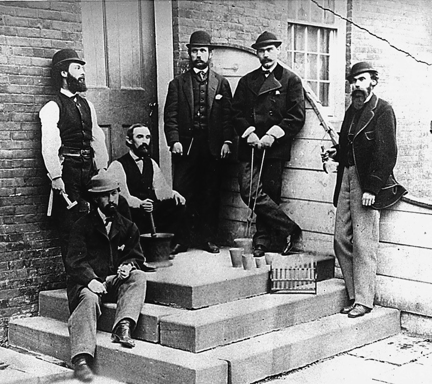 old picture of men on a stoop